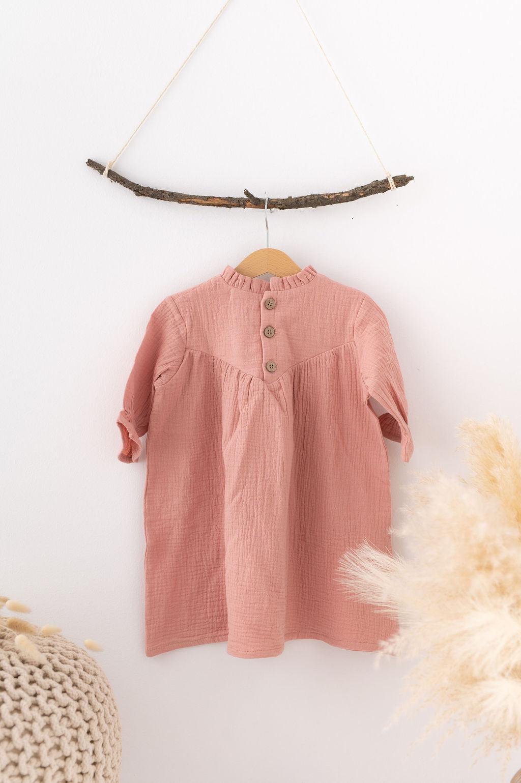 Pink baby dress with buttons hanging on wooden hanger Božična obleka za dojenčke by SOALSA