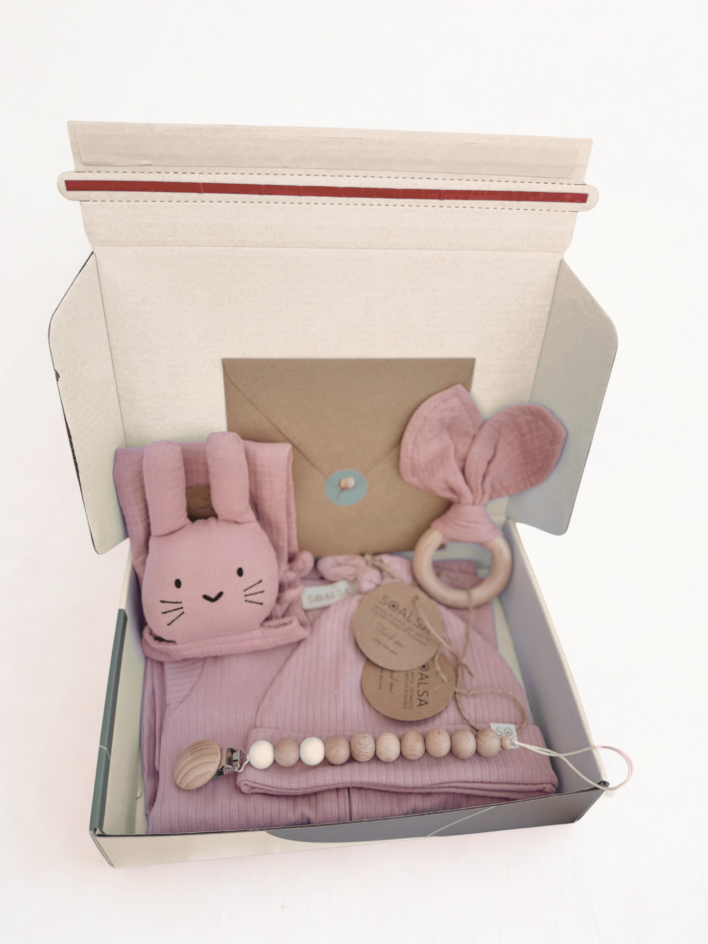 SOALSA gift set with baby pink bunny plush toy, wooden ring rattle, pacifier clip, and cloth in darilo ob rojstvu