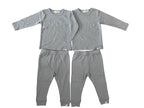 Gray children's pajama set on a tiled floor