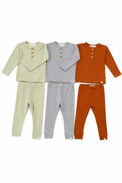 Three sets of children's clothing in green, gray, and orange on a white background