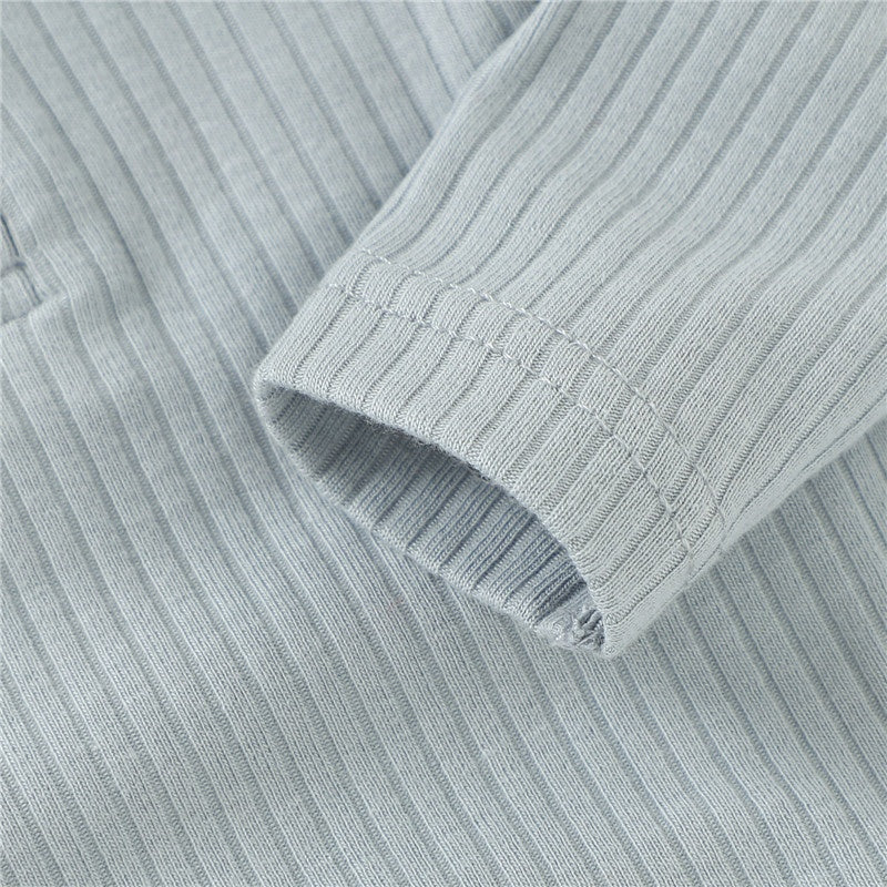 Close-up of ribbed fabric with a focus on texture and pattern.