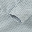 Close-up of ribbed fabric with a focus on texture and pattern.