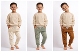 Three images of a child wearing different colored pants with a beige sweatshirt on a white background.