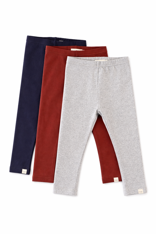 Three pairs of leggings in navy, red, and gray on a white background