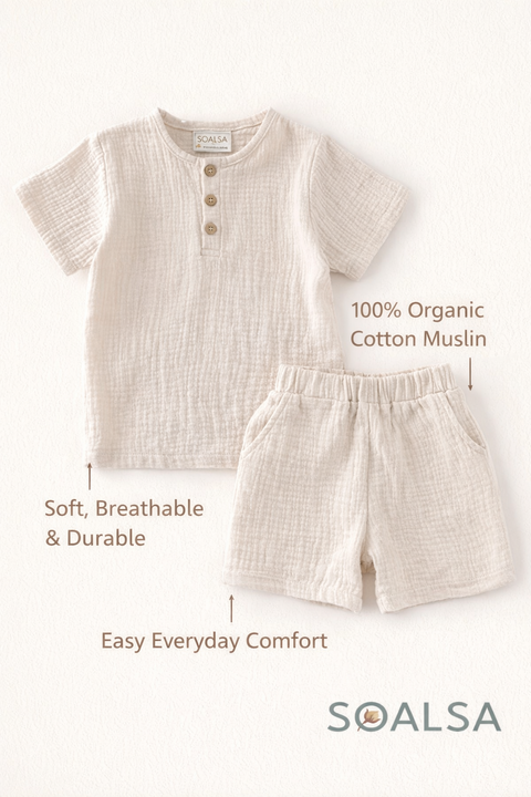 Children's outfit with shirt and shorts on a white background, featuring SOALSA branding.