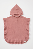 Pink hooded poncho with ruffled edges on a white background