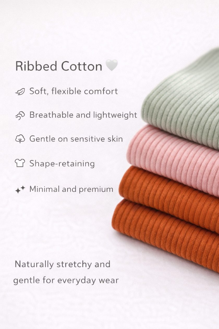 Stack of ribbed cotton fabric in green, pink, and orange on a white background with text describing the fabric's properties.