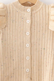 Beige ribbed sweater with button details on a hanger