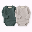 Two baby rompers, one green and one gray, with 'SOALSA' branding on a white background.