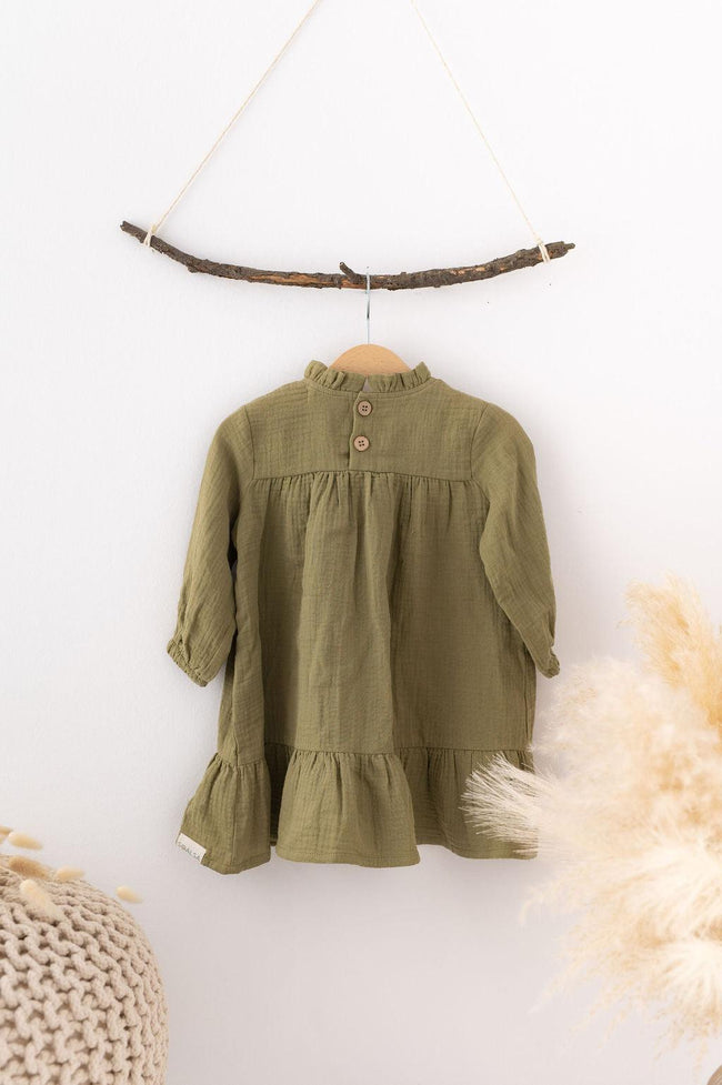 SOALSA muslin dress for kids in olive green hanging on a wooden hanger Božične obleke za otroke