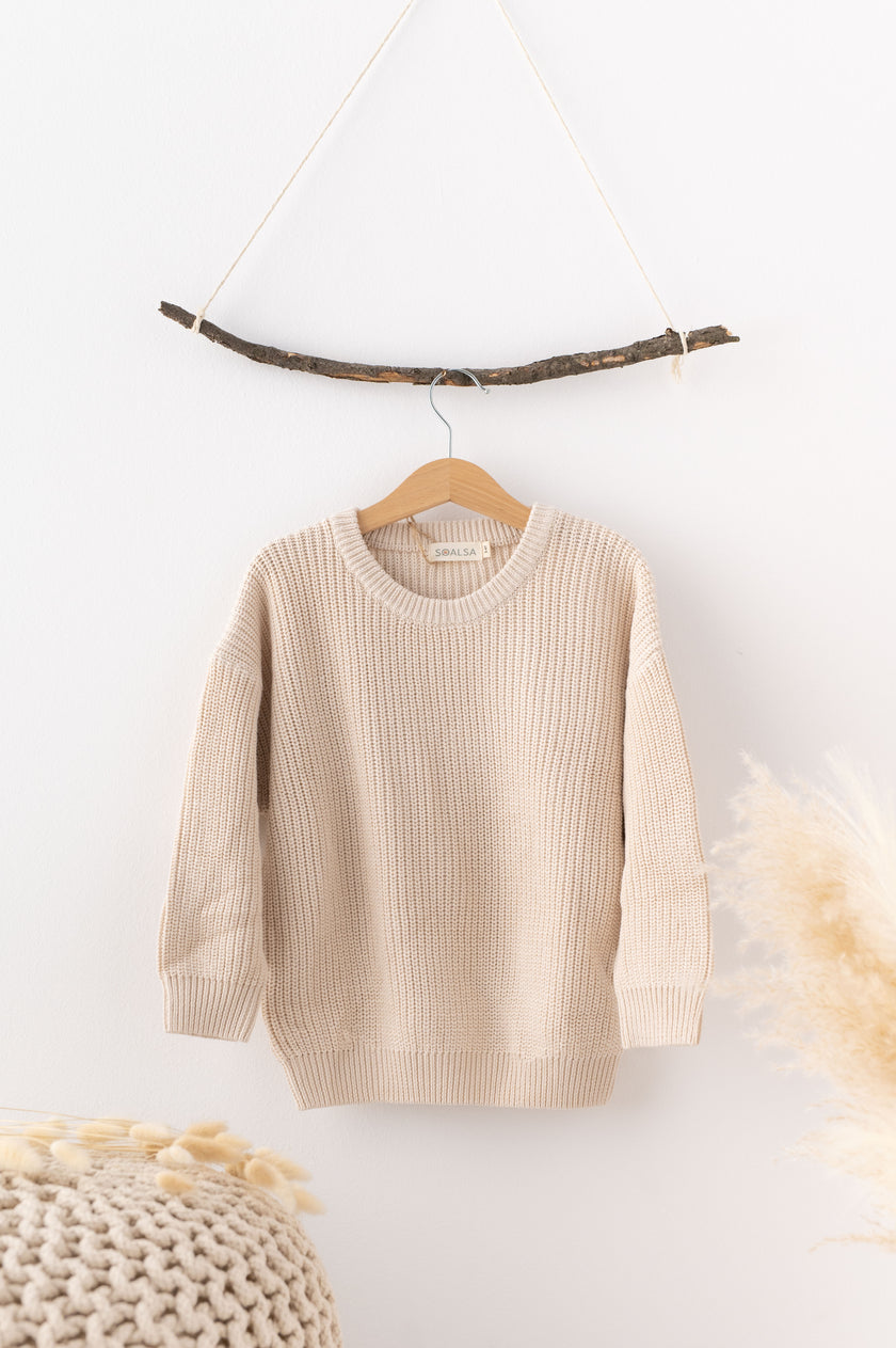 SOALSA beige knitted sweater for children displayed for božični puloverji za otroke