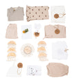 Collection of baby clothing and accessories on a white background