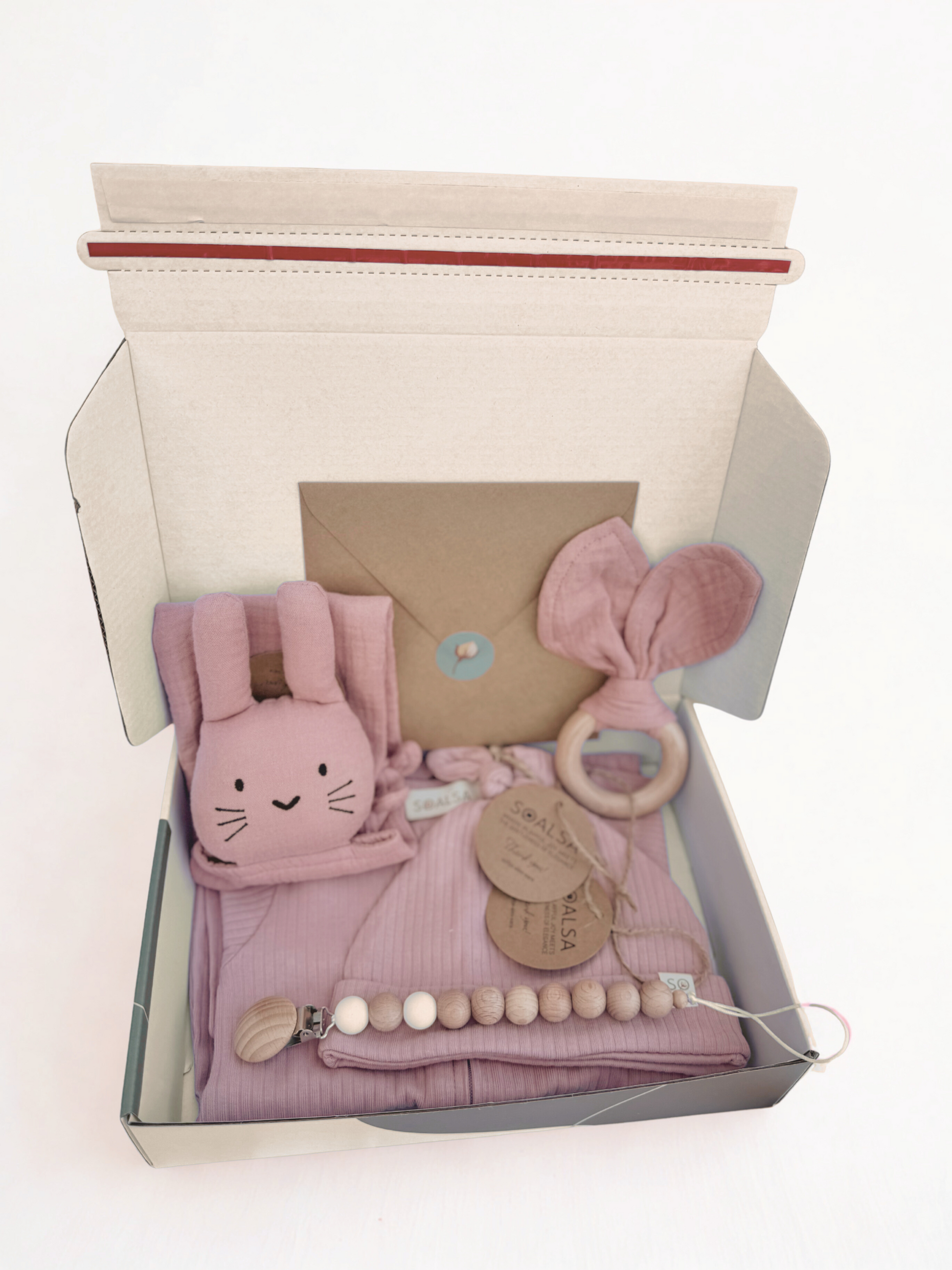 SOALSA gift set with baby pink bunny plush toy, wooden ring rattle, pacifier clip, and cloth in darilo ob rojstvu
